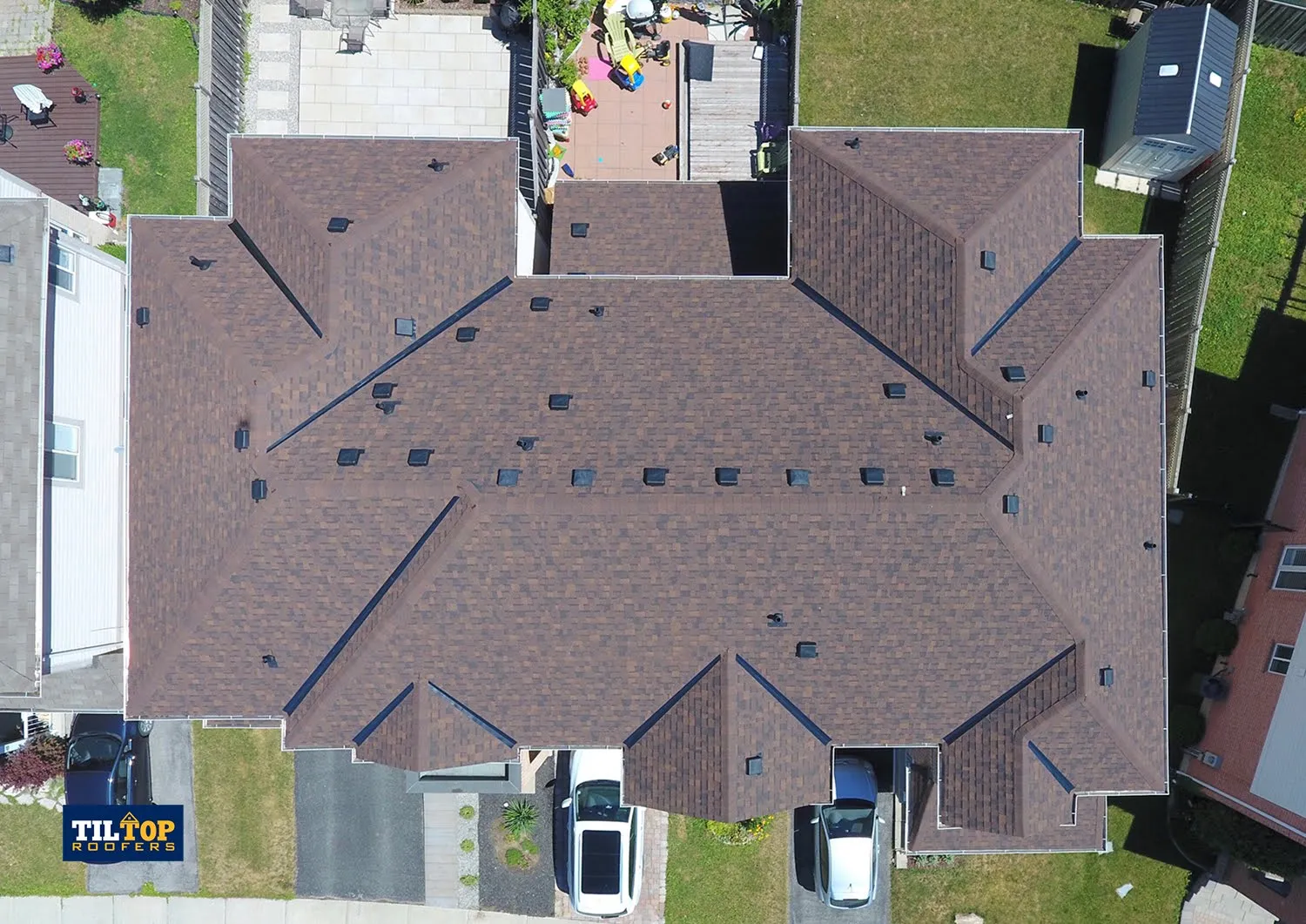 townhouse-unit-roof-replacement-brown-shingles-new-vents